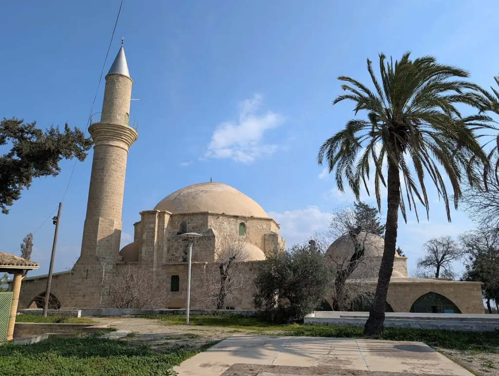 Hala Sultan Tekkesi mosque near Larnaca, Cyprus, with minaret and palm tree, January 2025.
