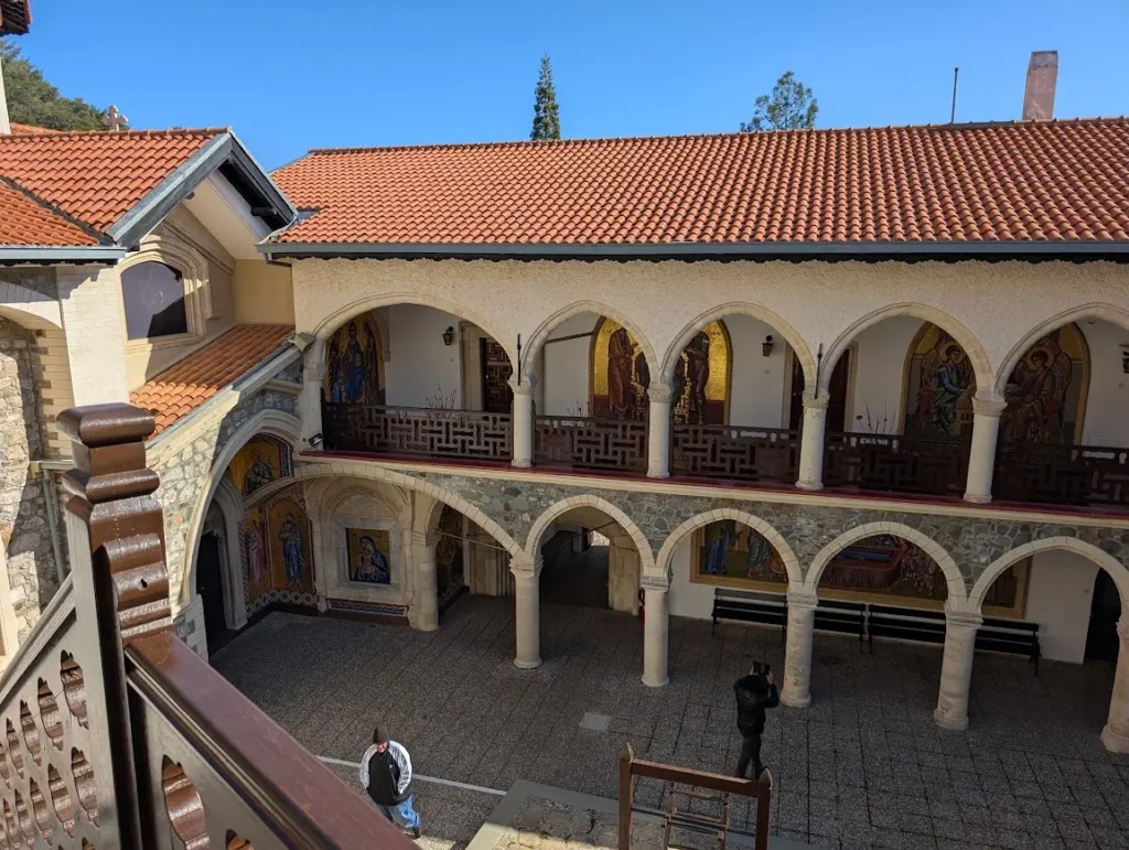 Courtyard of Kykkos Monastery in the Troodos Mountains, Cyprus, with arched colonnades and Byzantine mosaic icons, January 2025.