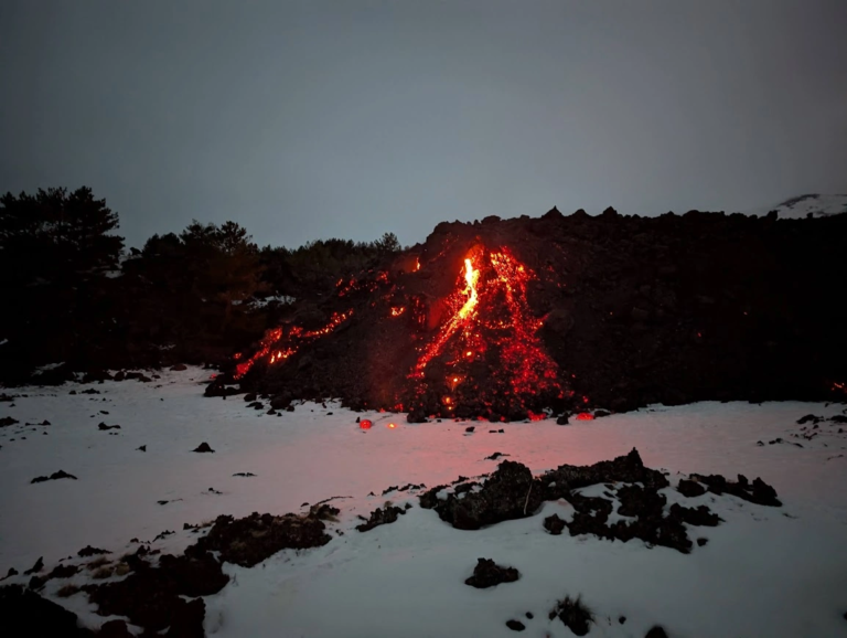 Active lava flow on Mount Etna at twilight, photographed during a hike on the Pista Altomontana trail, Sicily