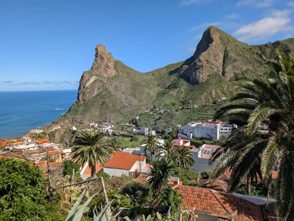White village of Taganana below steep green rock peaks on the Anaga coast, northern Tenerife
