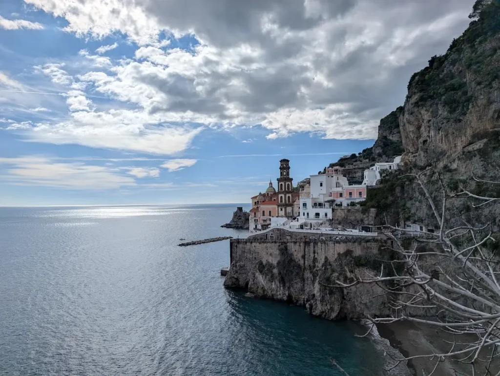 Cliffside village of Atrani with church bell tower perched above the Tyrrhenian Sea, Amalfi Coast, Italy
