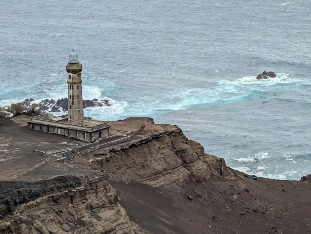 Abandoned Capelinhos lighthouse on volcanic ash cliff, Faial island, Azores