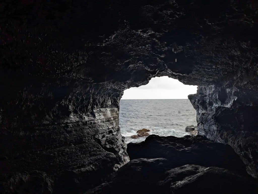 Inside Gruta das Agulhas lava tube looking out to the Atlantic Ocean, Terceira, Azores