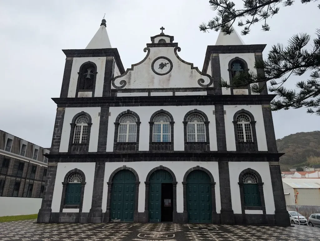 White and black stone church facade in Madalena, Pico island, Azores