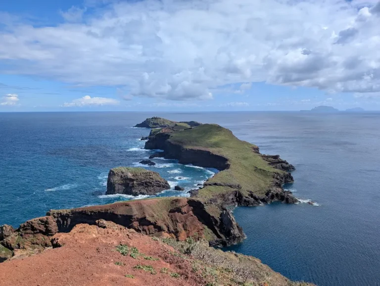 Panoramic view of the rugged, volcanic coastline and hiking trail at Ponta de São Lourenço, Madeira.
