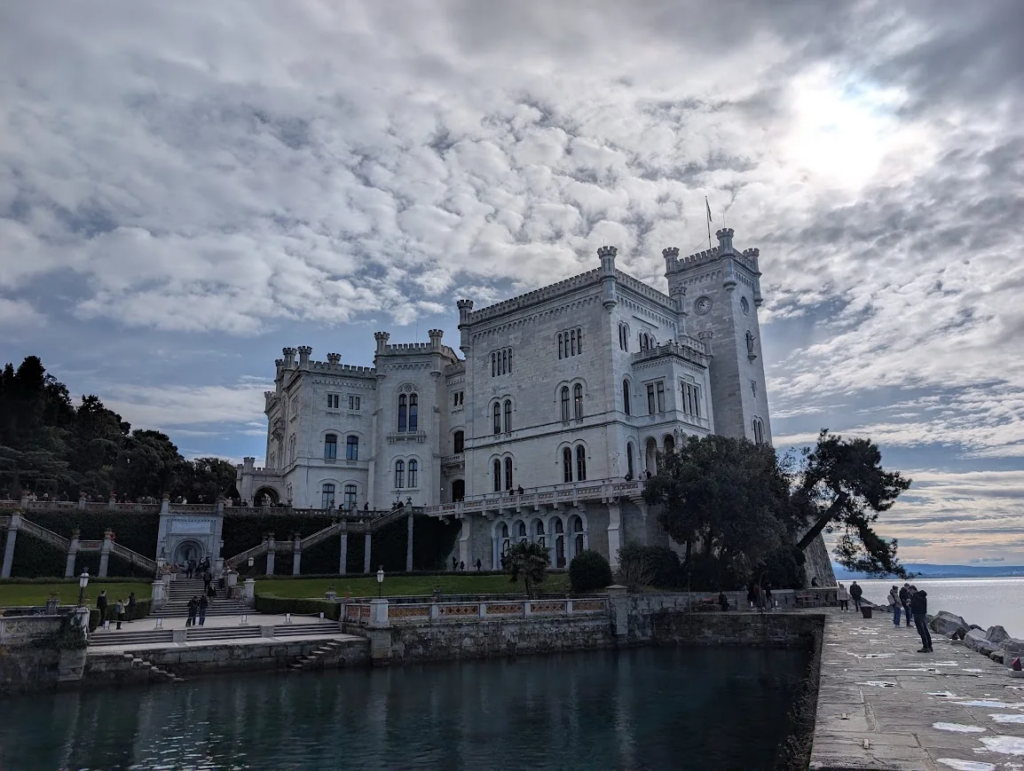 Miramare Castle on the seafront near Trieste with dramatic cloudy sky