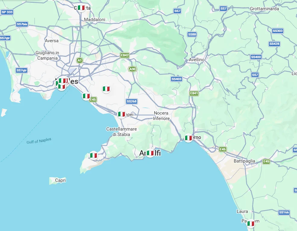 Map of the Naples region showing visited stops including Naples, Herculaneum, Pompeii, Amalfi Coast and Paestum, marked with Italian flag pins.