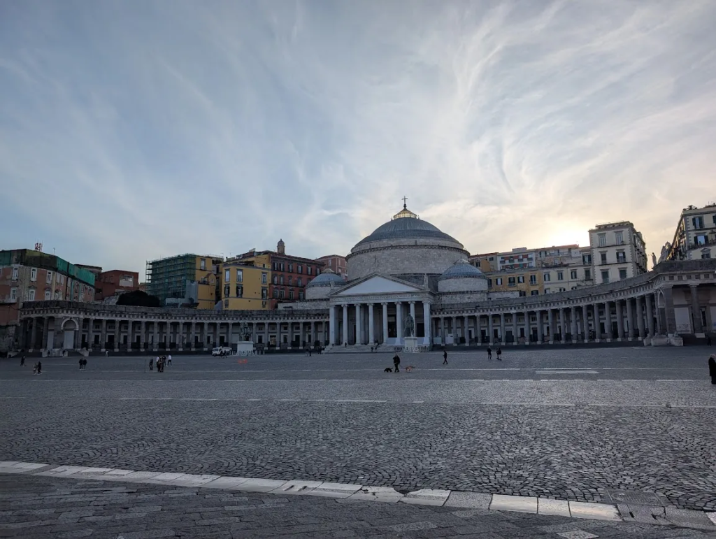 Piazza del Plebiscito in Naples at dusk with the neoclassical church of San Francesco di Paola and its colonnaded square, Italy
