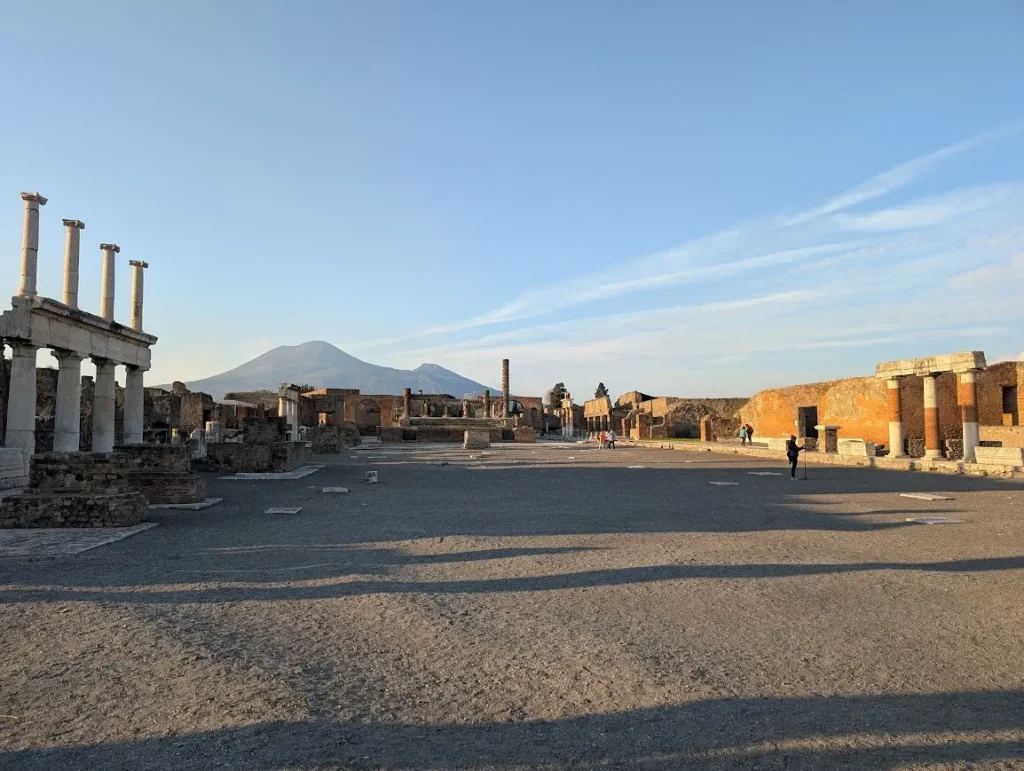 View across the ruins of Pompeii with Mount Vesuvius visible in the background, Naples, Italy.