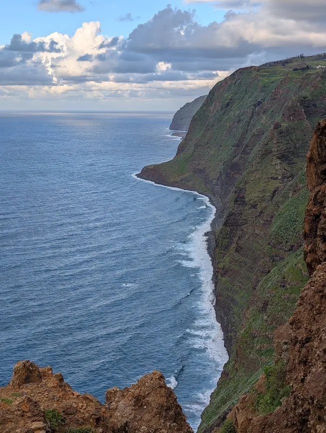 Steep green sea cliffs on Madeira's western coast near Ponta do Pargo at sunset
