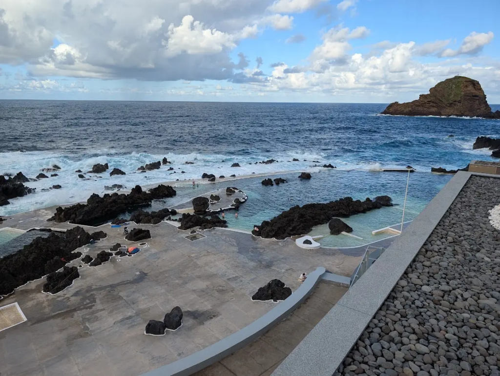Porto Moniz natural swimming pools with volcanic rock and rough Atlantic waves