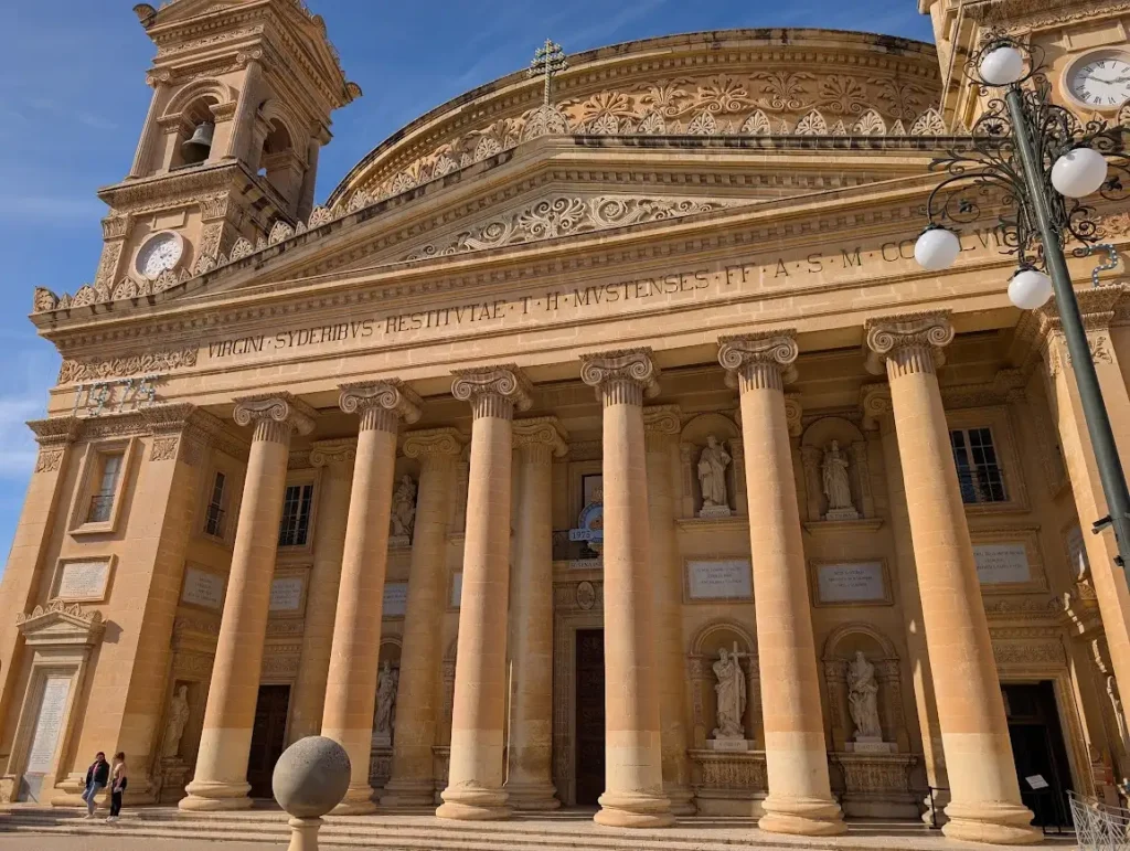 Neoclassical facade of the Rotunda of Mosta with Ionic columns and sandstone carvings, Mosta, Malta