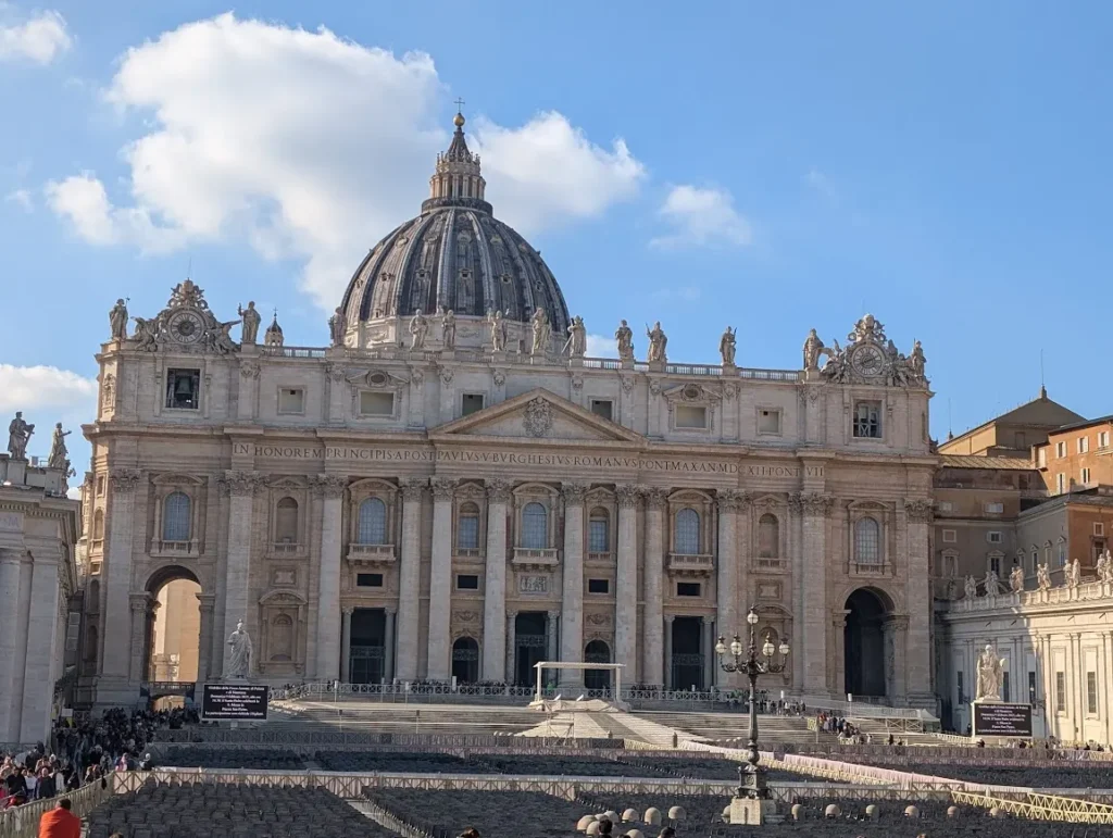 Facade of St. Peter's Basilica with its dome and colonnaded square, Vatican City, Rome