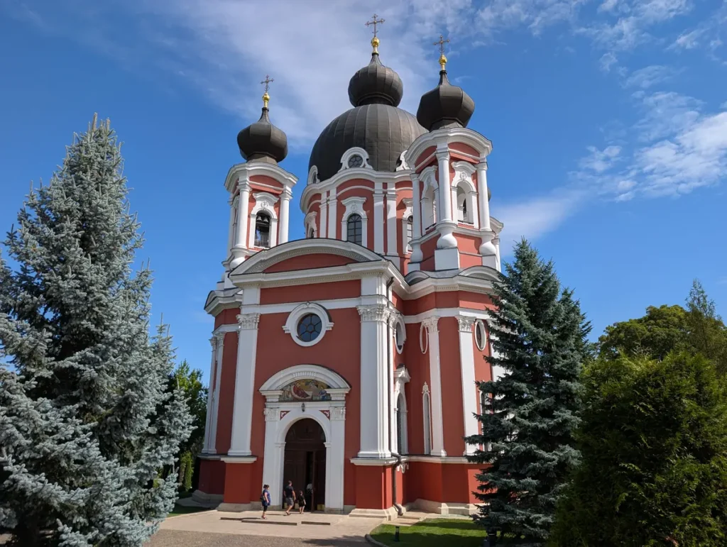 Curchi Monastery exterior with baroque architecture and black onion domes, Moldova