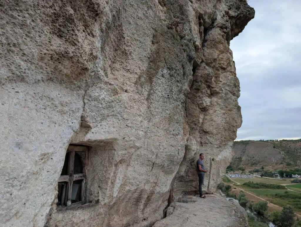 Old Orhei cave monastery carved into cliff face at Orheiul Vechi archaeological complex, Moldova