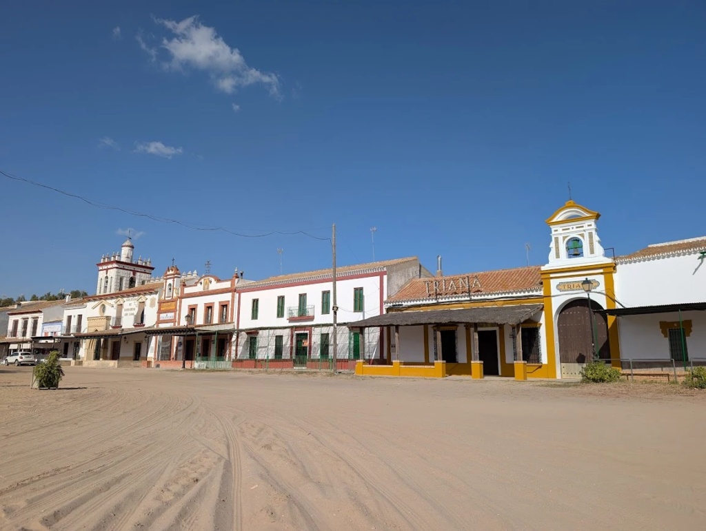 Sand streets and whitewashed buildings in El Rocío pilgrimage village, Andalusia, Spain