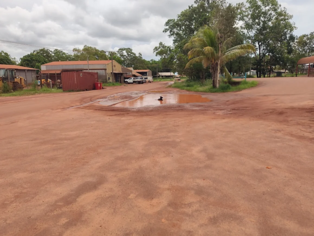 A red dirt road outside the Maningrida store, turned muddy after heavy rain.