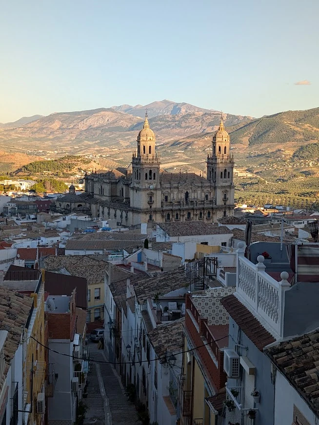 View over Jaén with twin baroque cathedral towers and mountains behind