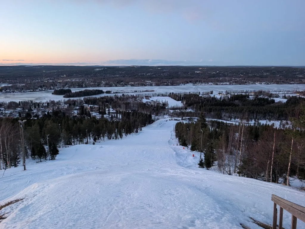 View over Rovaniemi and frozen lakes from Ounasvaara hill, Finland, March 2026