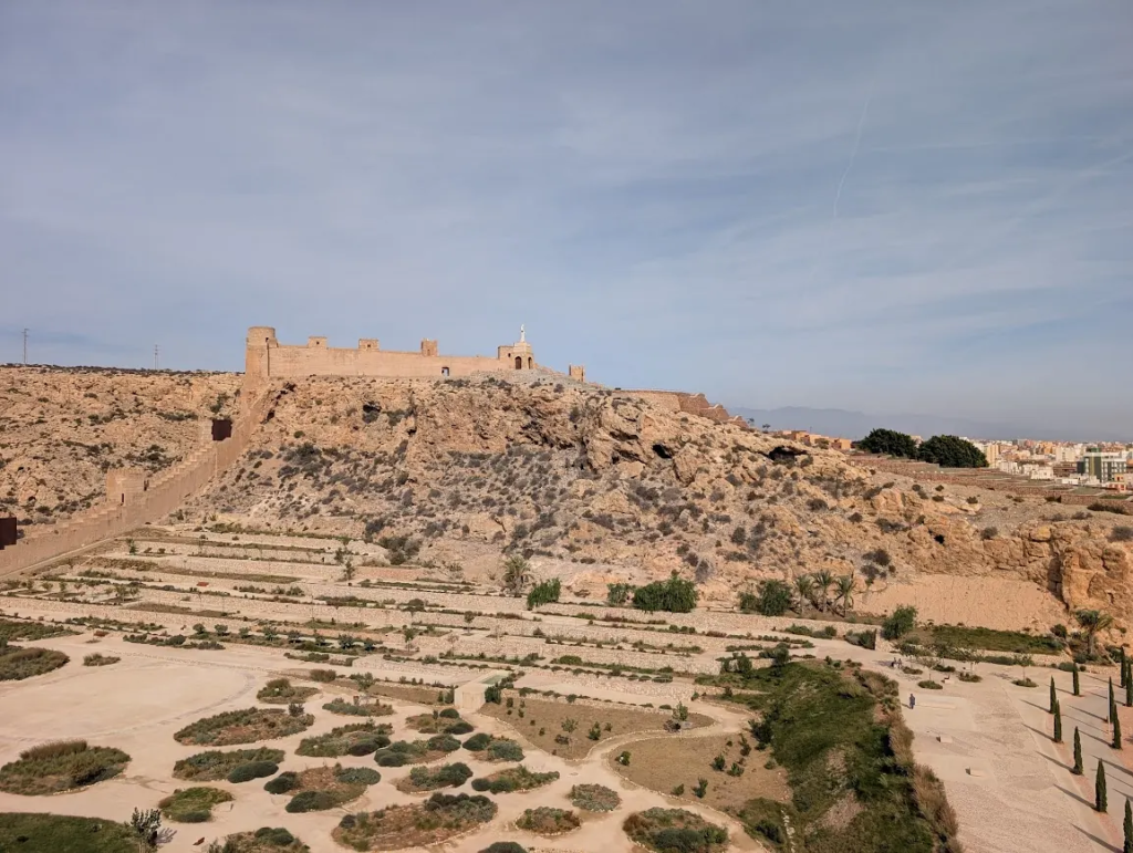 Alcazaba fortress on a hilltop above landscaped gardens in Almería, Spain