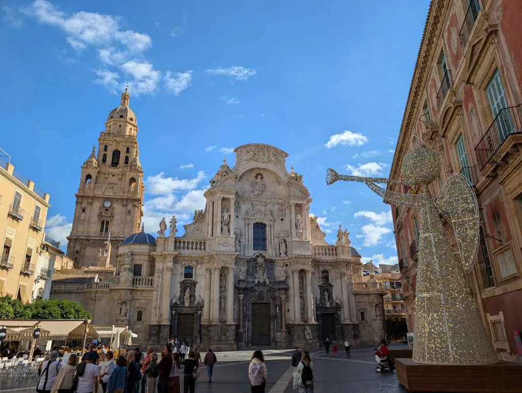 Murcia Cathedral facade in the main plaza, with its Baroque bell tower rising above the square