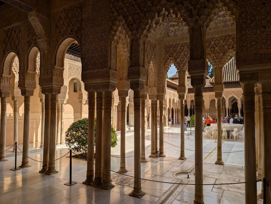 Colonnaded courtyard with carved arches inside the Nasrid Palaces, Alhambra