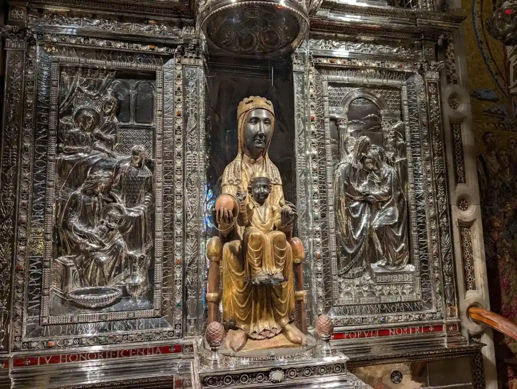 The Black Madonna statue at Montserrat Abbey, gold and silver reliquary with ornate engraved panels