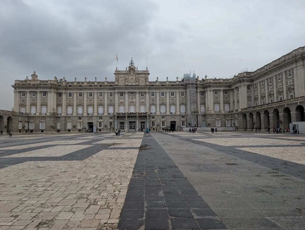 Royal Palace of Madrid, Spain, seen from the empty stone courtyard on an overcast December day