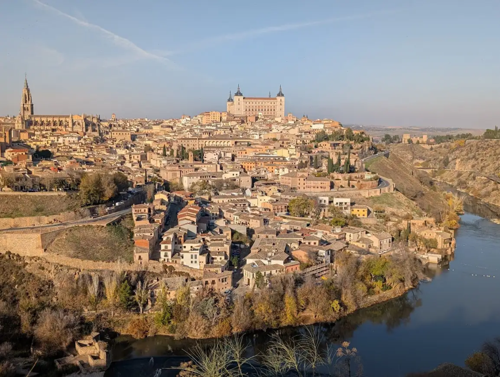 View of Toledo, Spain, from Mirador del Valle, with the cathedral tower and Alcázar above the old town and the Tagus river below